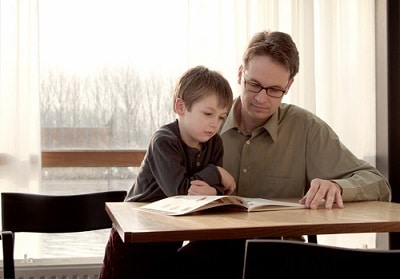 Man reading with soon after eye exam and new glasses